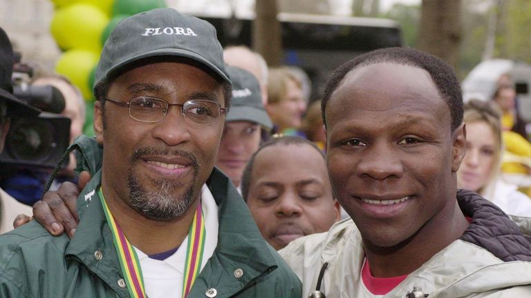 Michael Watson is congratulated by Chris Eubank at the London Marathon finish line