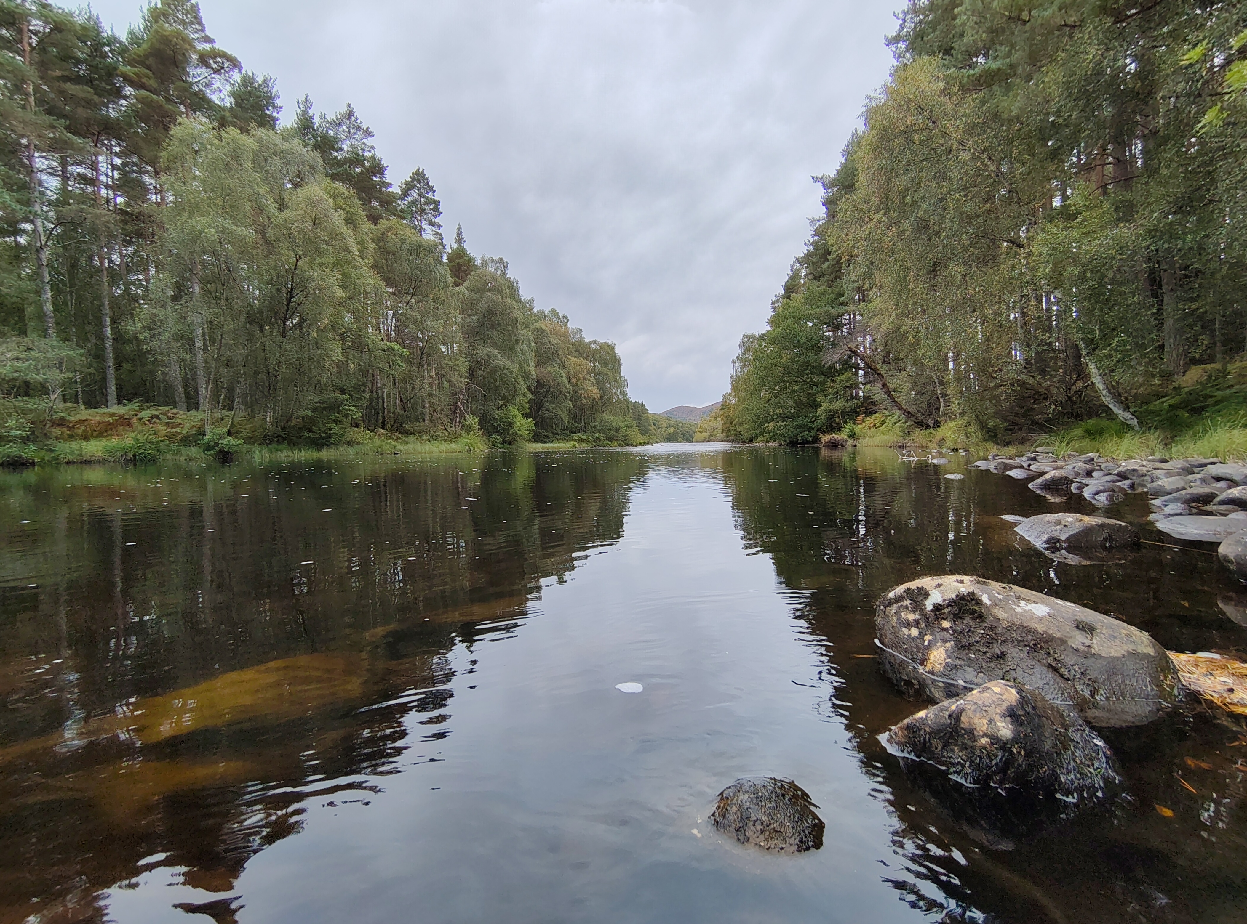 A camera sample taken on the Fairphone 6 showing a river with a mountain in the background.