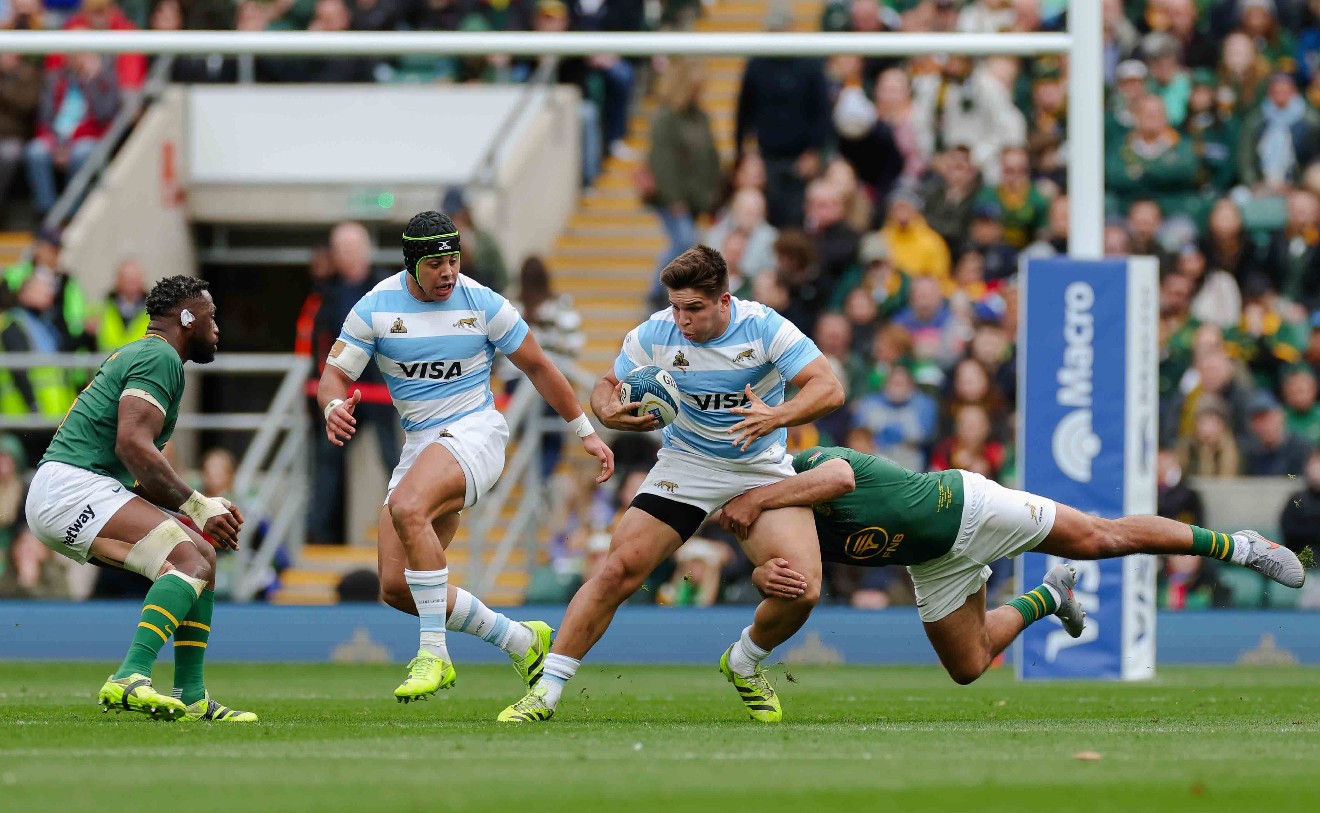 Justo Piccardo of Argentina being tackled by Damian de Allende of South Africa during a rugby match.