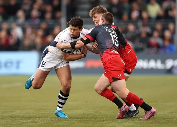 Louis Rees-Zammit of Bristol is tackled by Nick Tompkins of Saracens