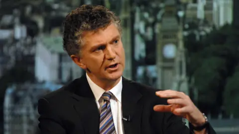 Jonathan Powell, dressed in a suit and tie, speaking on the BBC's The Andrew Marr Show in 2008.