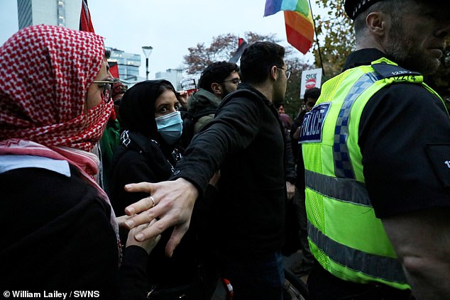 People walk through the streets during a pro-Palestinian march in Manchester centre on Thursday evening
