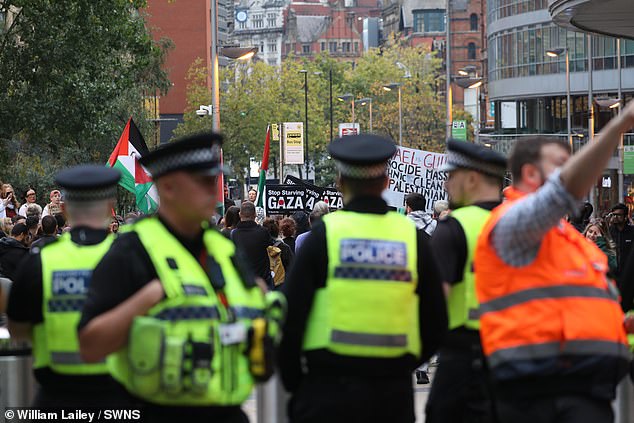 Pro-Palestinian protestors march in Manchester centre on the day a knifeman killed two people at a synagogue in the city just miles away