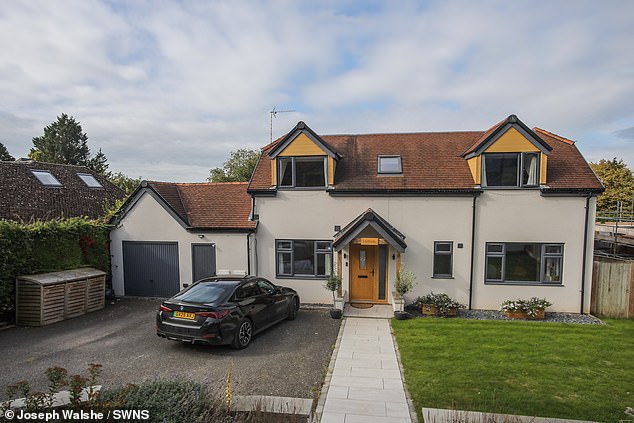 Before buying the property, the Harrison-Ellis' were made aware of historical building restrictions which dated back to when the two properties shared the same plot, according to High Court documents. Pictured: The Harrison-Ellis' home in Goring