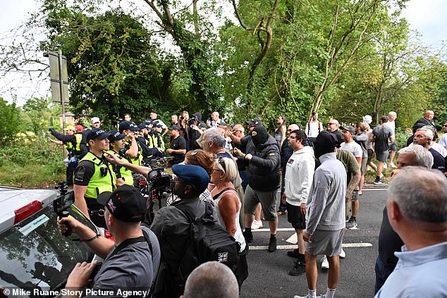 Protesters, some wearing masks, confronted police officers during the protest in Epping after a Bell Hotel resident was accused of sexually assaulting a teenage girl