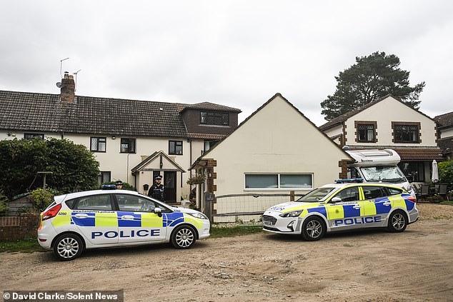Police outside the family's home in Bordon, Hampshire