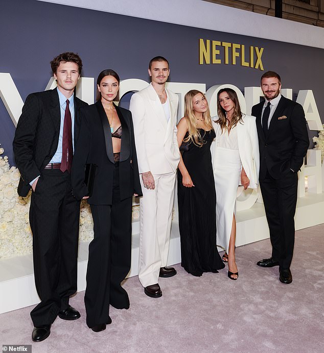 As well as Harper, the former Spice Girl was supported by her husband David (right) and children Cruz (left), his girlfriend Jackie Apostel and Romeo on the night