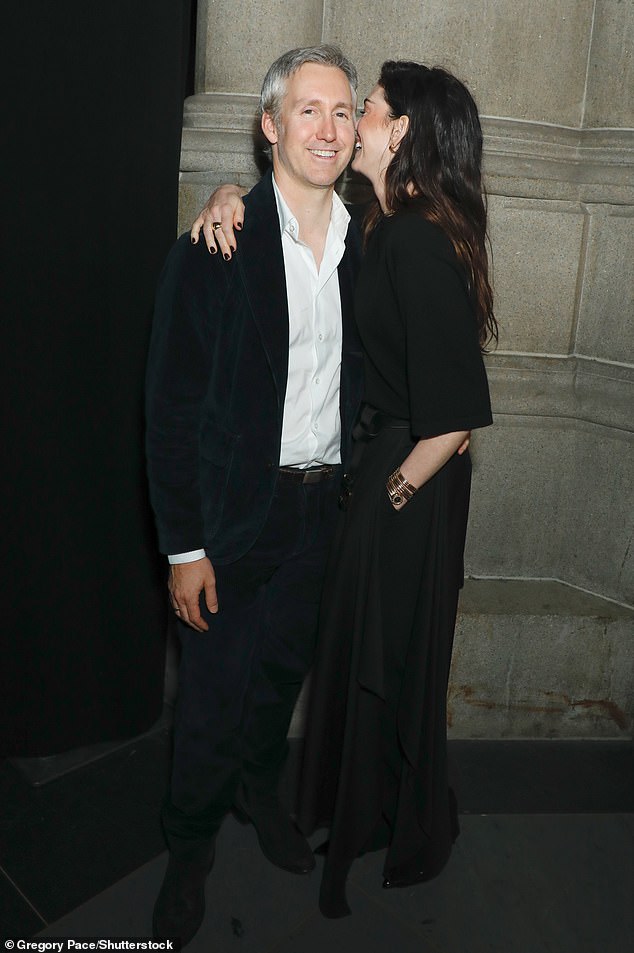 The pair looked smitten as they posed for red carpet snaps together, with Anne appearing to whisper in Adam's ear before bursting out laughing