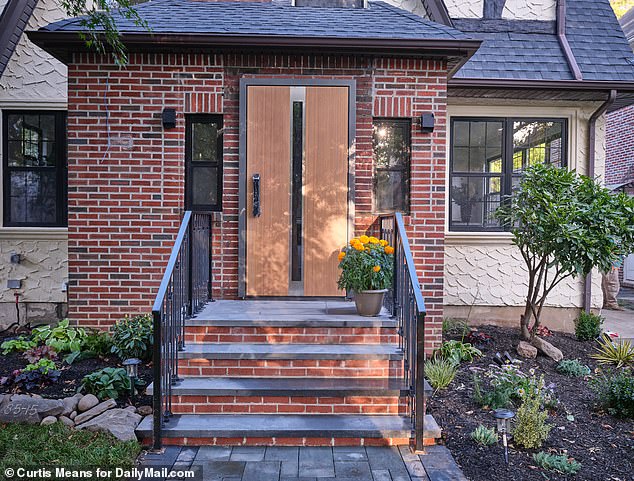 The two-story Tudor-style home at 85-15 Wareham Place in Jamaica Estates, Queens, underwent an extensive renovation and has a new aesthetic that some are calling 'Manhattan modern'