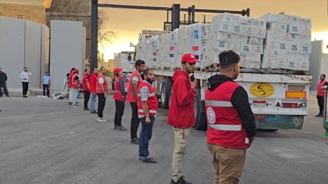Trucks carrying humanitarian aid supplies pass through the Rafah Border crossing in Egypt.