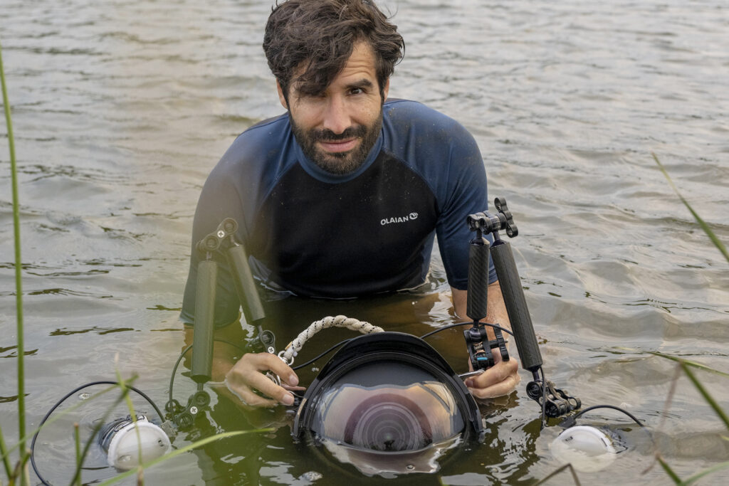 Jon A. Juarez shoots sturgeon release in the Oder River in Germany.