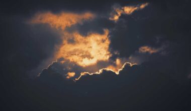 A silver lining breaks through dark, stormy clouds.