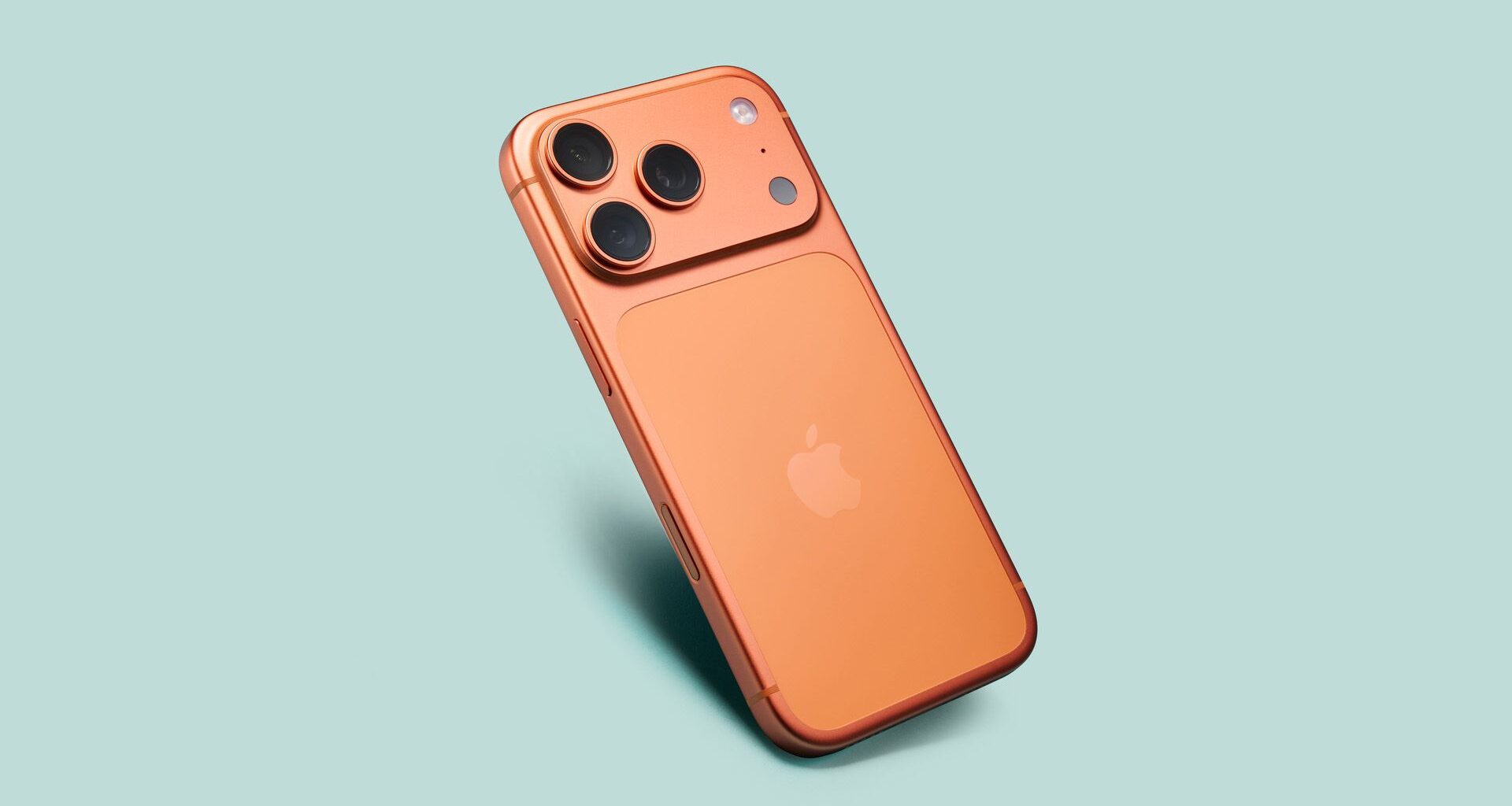 Apple iPhone 17 Pro in cosmic orange on green background