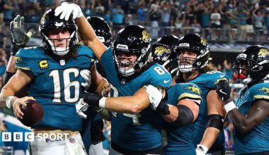Jacksonville Jaguars quarterback Trevor Lawrence (left) is congratulated by team-mates against the Kansas City Chiefs