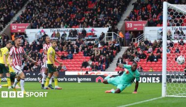 Ange Postecoglou holds his head