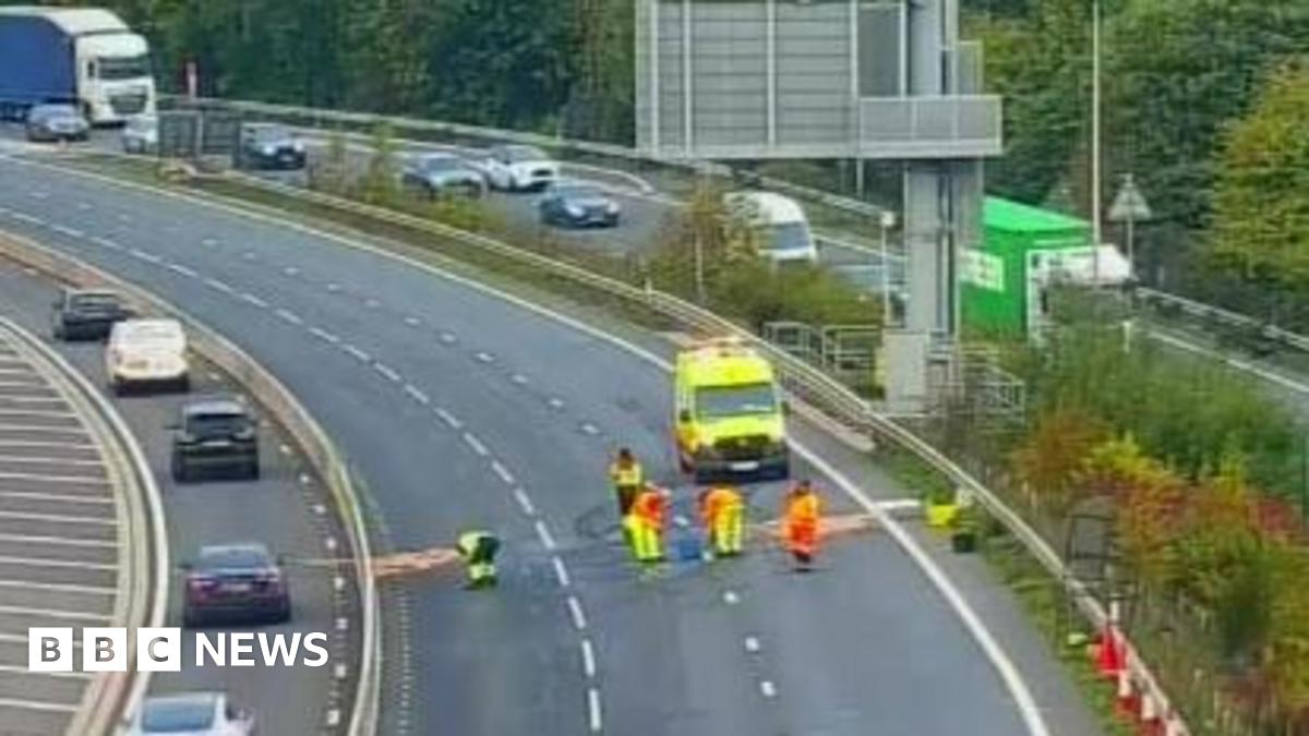 Motorway with workers seen in the lanes and piles of sand in a number of areas.