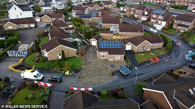 The crater (pictured in December) was initially temporarily filled in just in time for Christmas in December last year, with residents allowed back to their homes