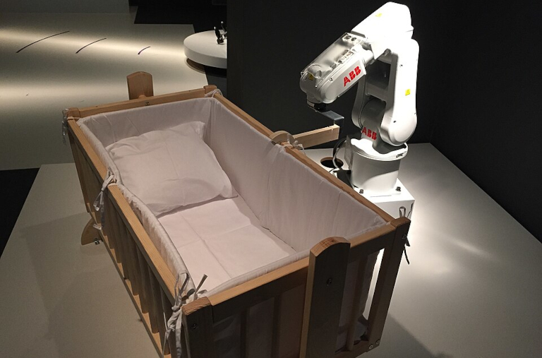 Robot looking at bed