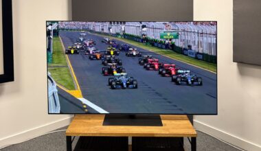 The 65-inch LG G5 OLED TV pictured on a wooden rack. On the screen is a still from Netflix F1 series Drive to Survive.