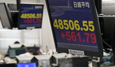 Asian markets mostly higher in quiet holiday trading after AI deals push Wall St to more records