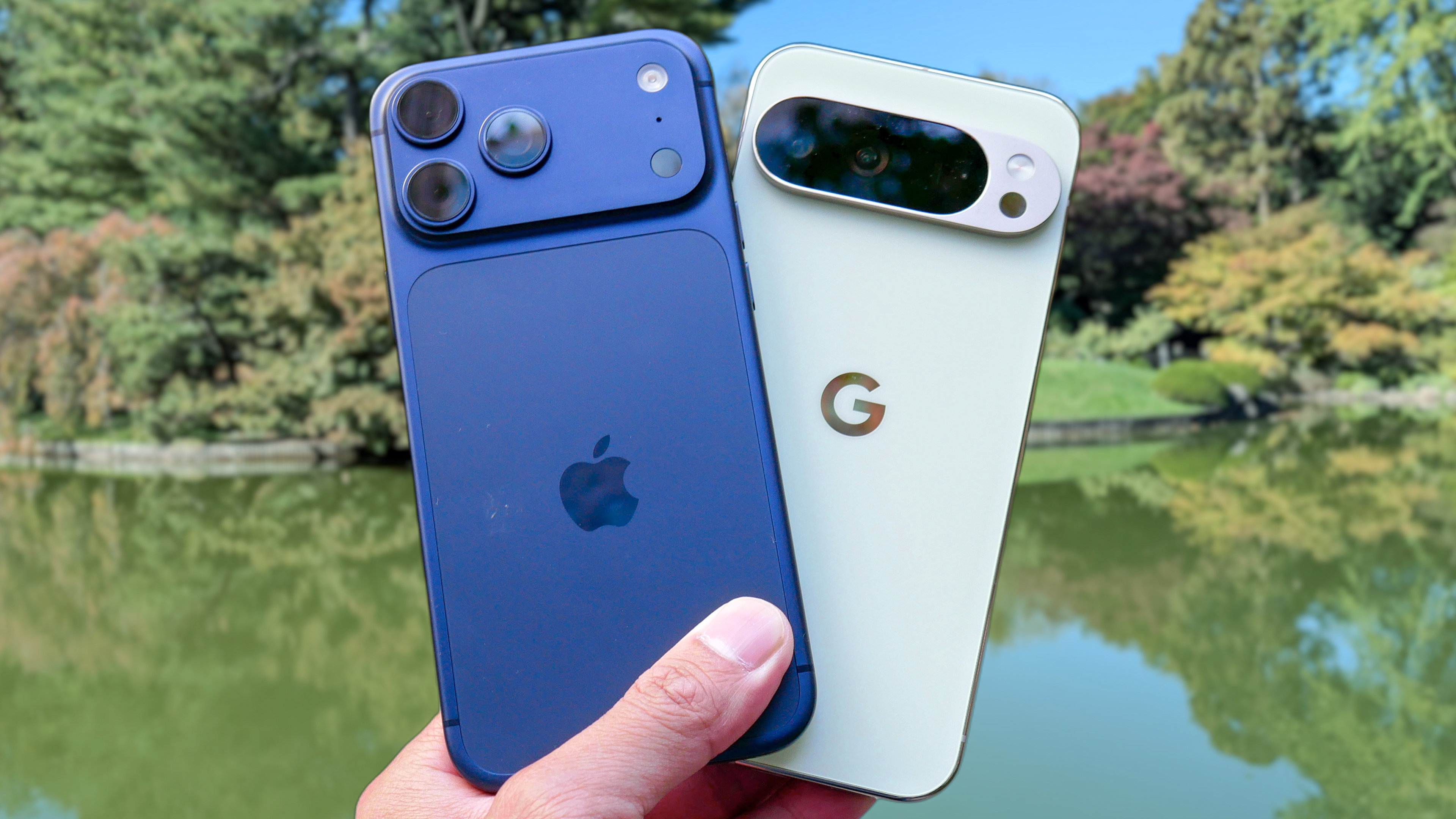 iPhone 17 Pro Max vs Pixel 10 Pro XL held in the hand.