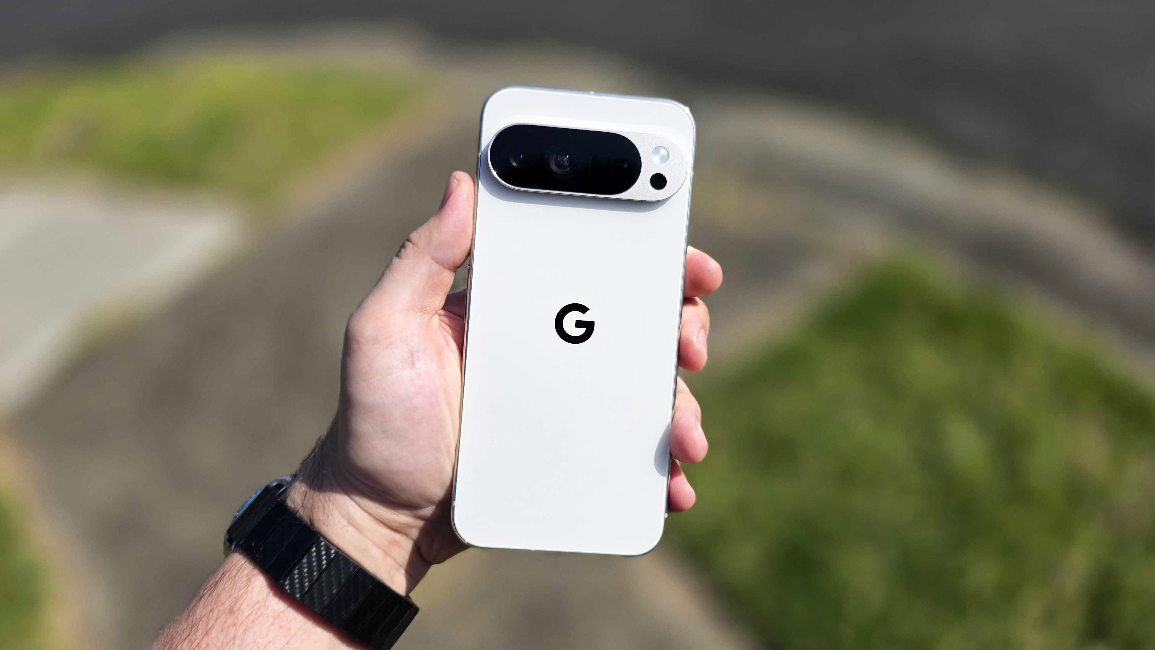 In-hand photo of the Google Pixel 10 Pro XL in outdoor setting