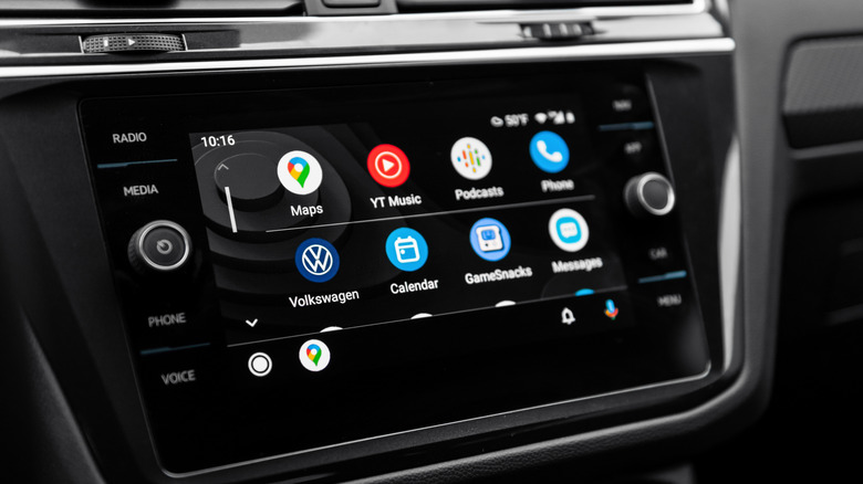 A vehicle's infotainment screen showing a list of apps in Android Auto, divided into four columns and two rows