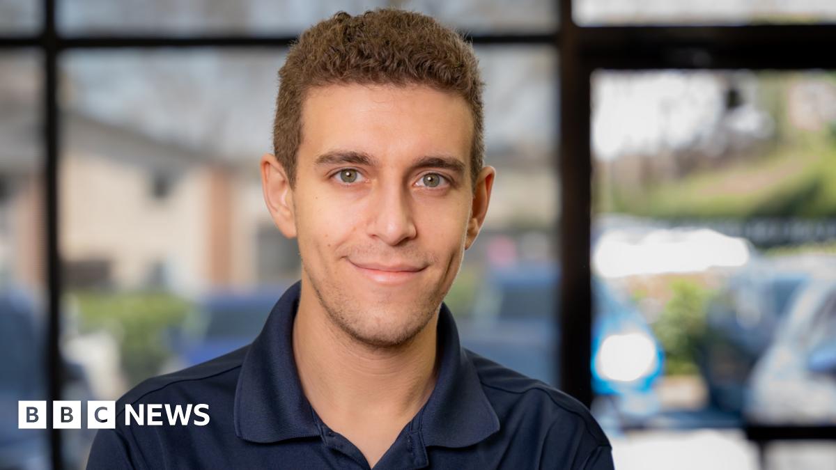 Close-up shot of Daniel Naroditsky wearing a deep navy polo