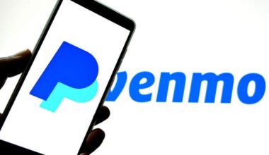 A phone with a PayPal "P" logo held in front of a blue Venmo logo.