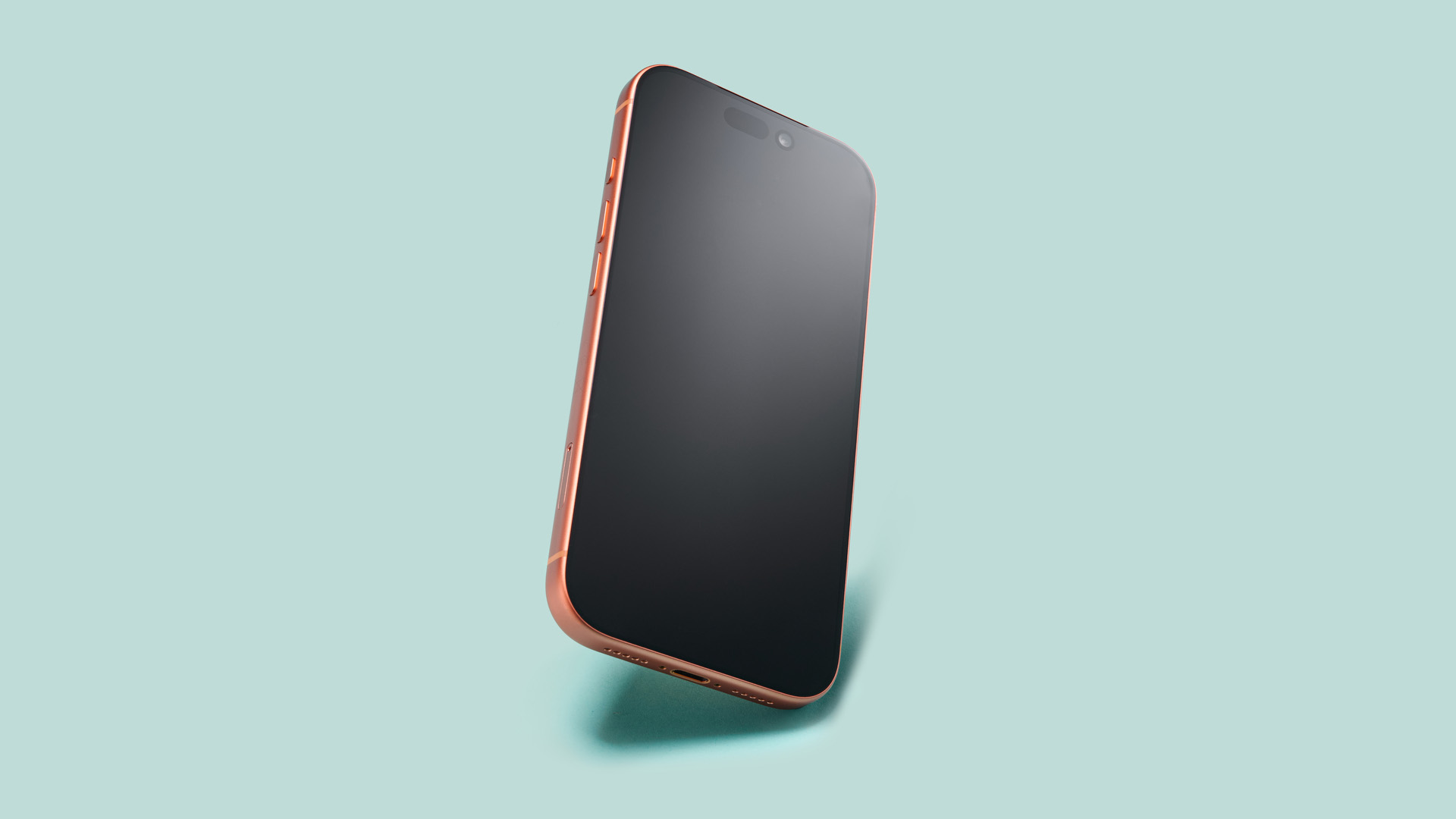 Apple iPhone 17 Pro in cosmic orange on green background