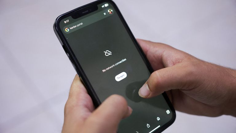 A man tries to use Google on his smartphone in the Afghan capital. Pic: Reuters