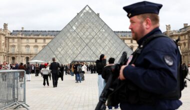 A French CRS riot police officer patrols near the glass pyramid of the Louvre on 27 October 2025. Pic: Reuters