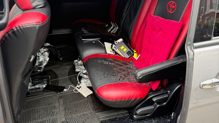Phones piled on the backseat of the suspects' car. Pic: Metropolitan Police
