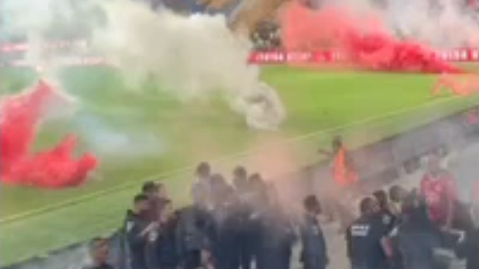 Flares on the pitch at Bloomfield Stadium. Pic: Israel Police