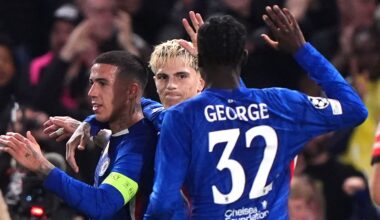 Chelsea players celebrate their opening goal against Benfica, an own goal scored by Richard Rios