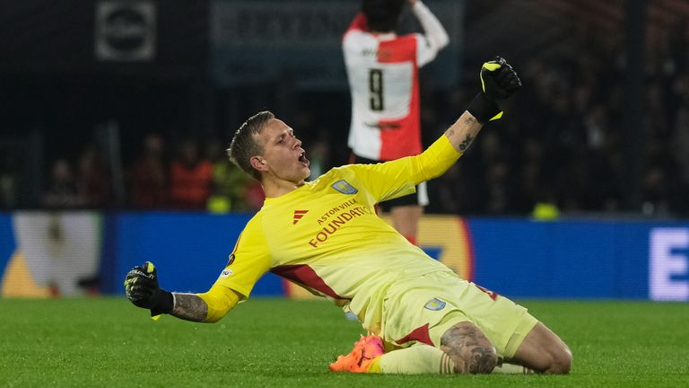 Aston Villa's goalkeeper Marco Bizot celebrates as his side go 2-0 up at Feyenoord