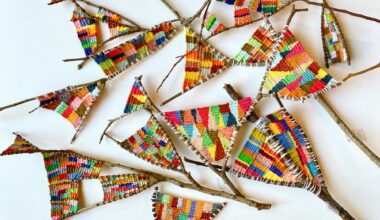 a collection of wish bones with colorful fiber woven between the bones by Kaci Smith