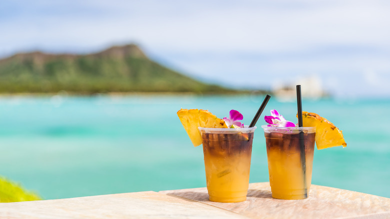 Two drinks against the background of a Hawaiian landscape