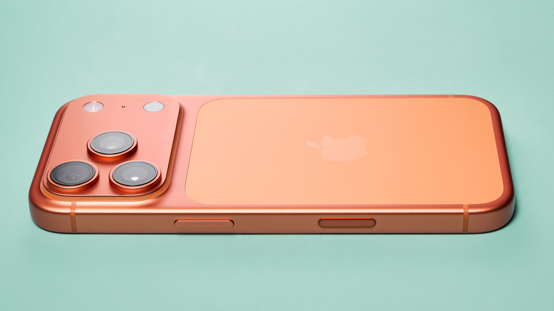 Apple iPhone 17 Pro in cosmic orange on green background