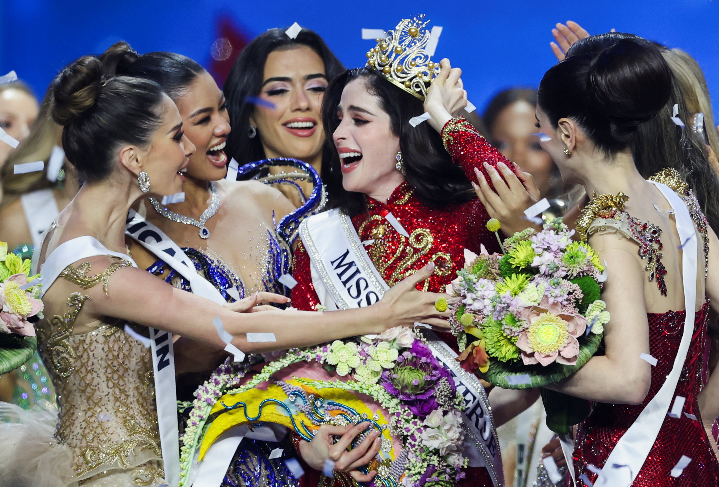 Fatima Bosch of Mexico reacts to being crowned Miss Universe 2025 as other contestants embrace her.