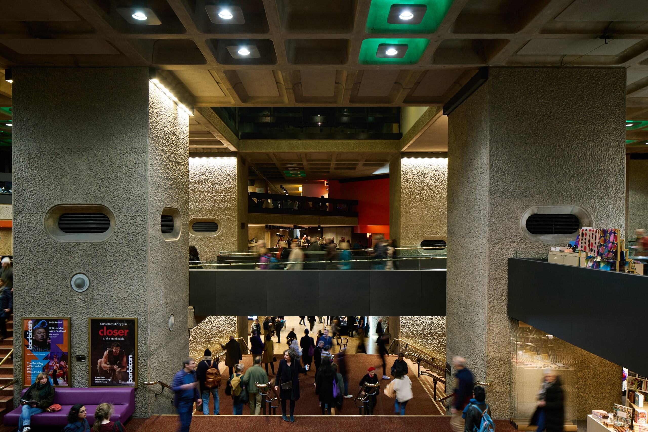 Barbican Centre foyer with people moving between levels.