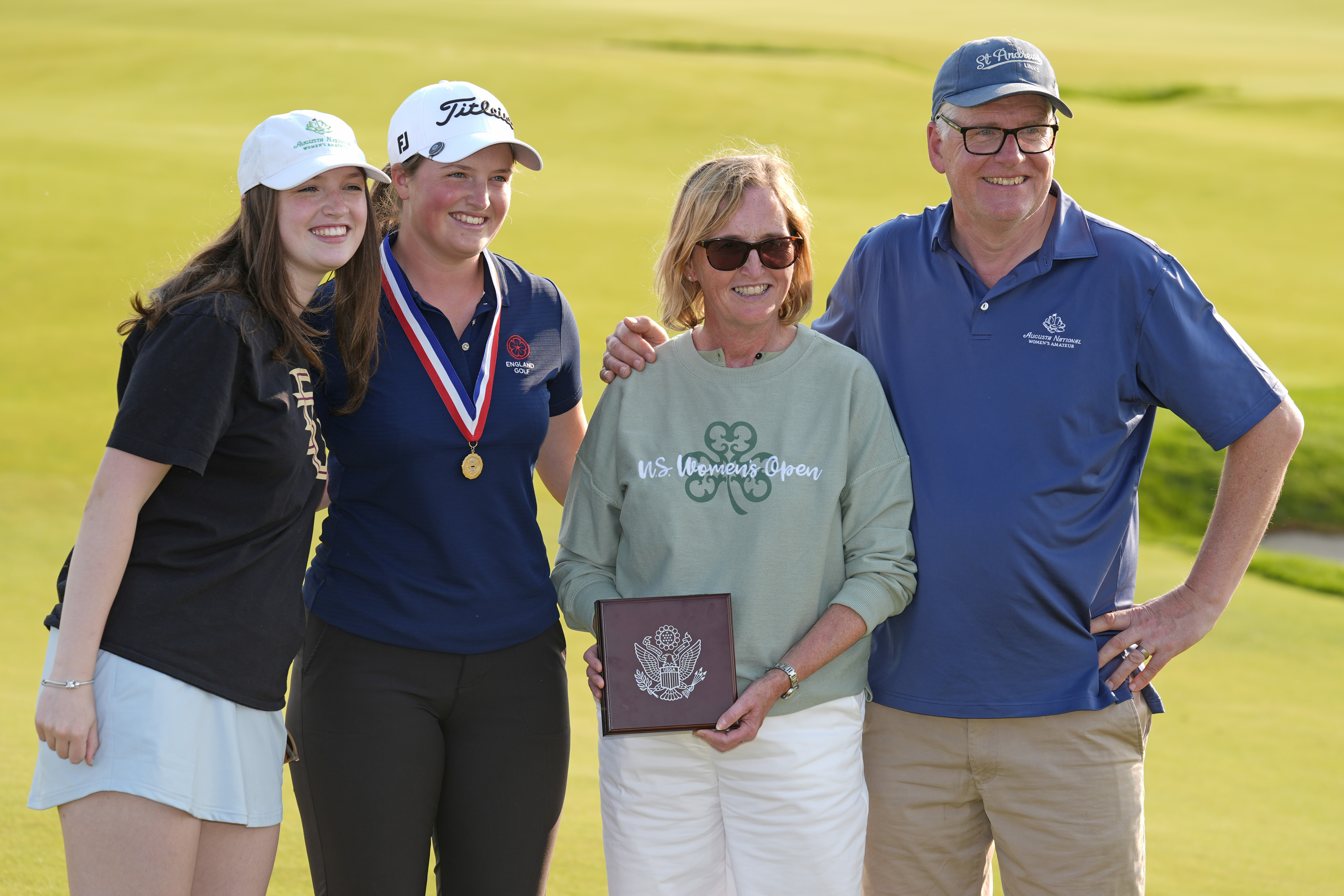 Lottie Woad of England with her family after winning the top amateur at the U.S. Women's Open.