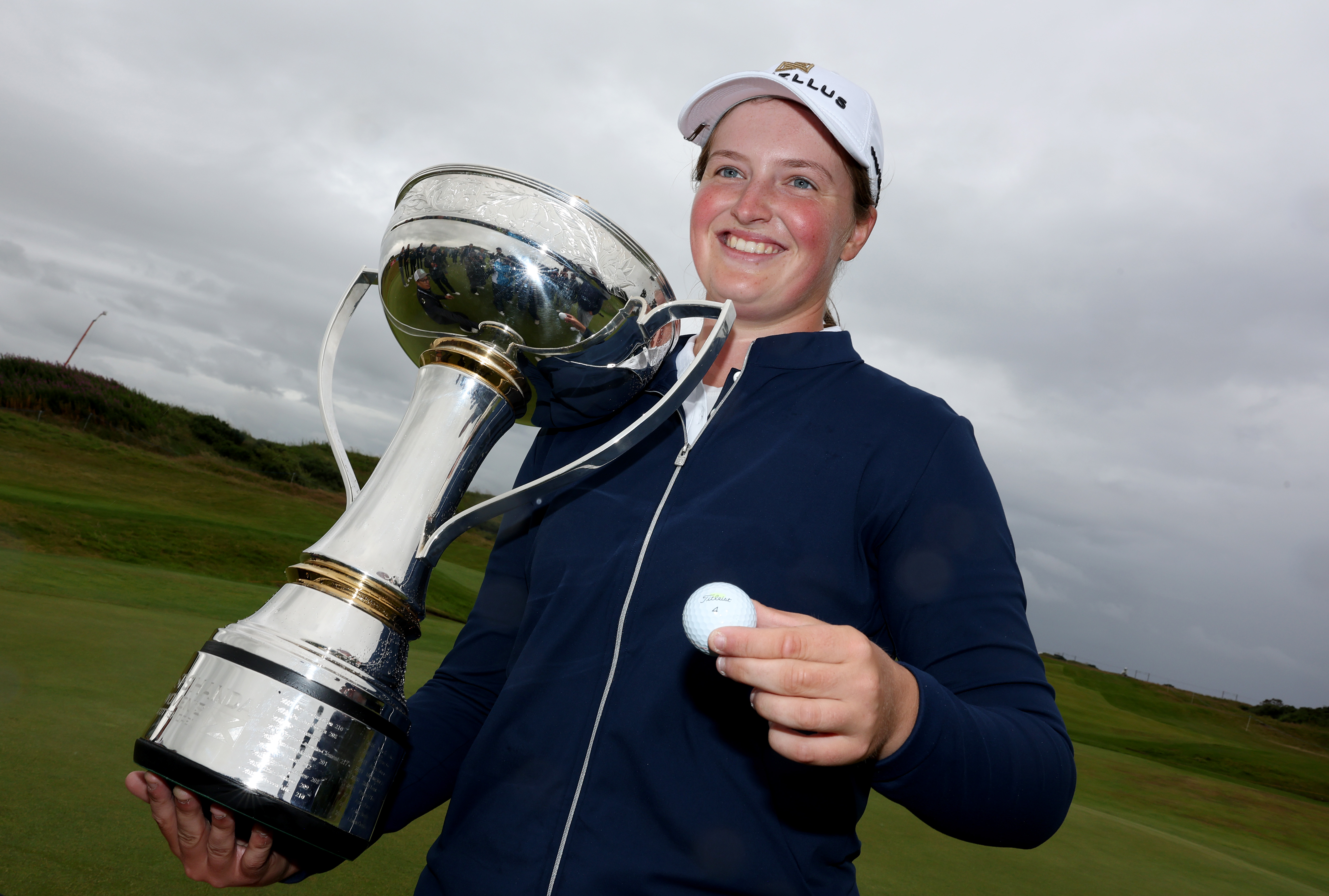 Lottie Woad of England with the ISPS Handa Women's Scottish Open 2025 trophy.
