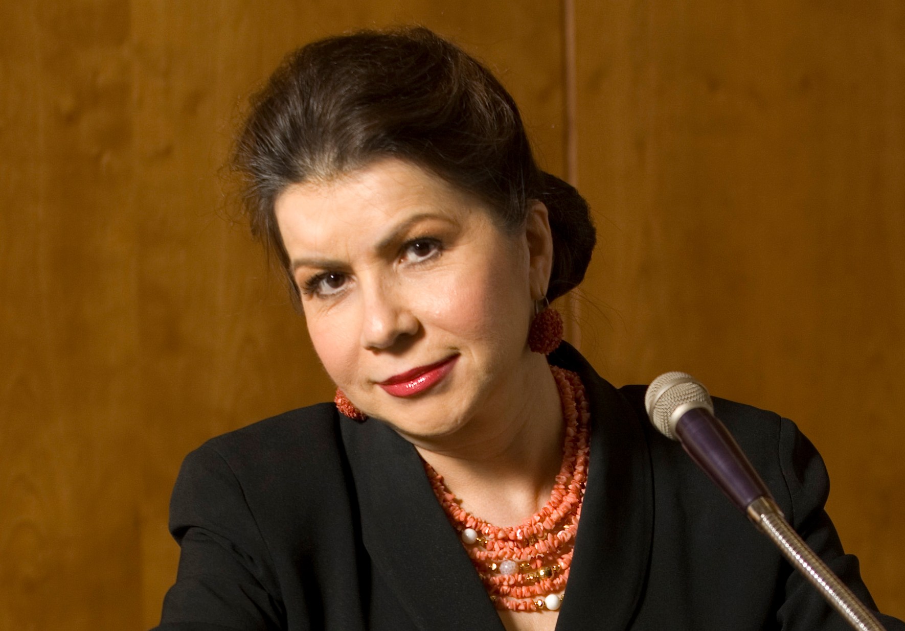 Carmen Reinhart, author of "This Time Is Different," speaking at a podium.