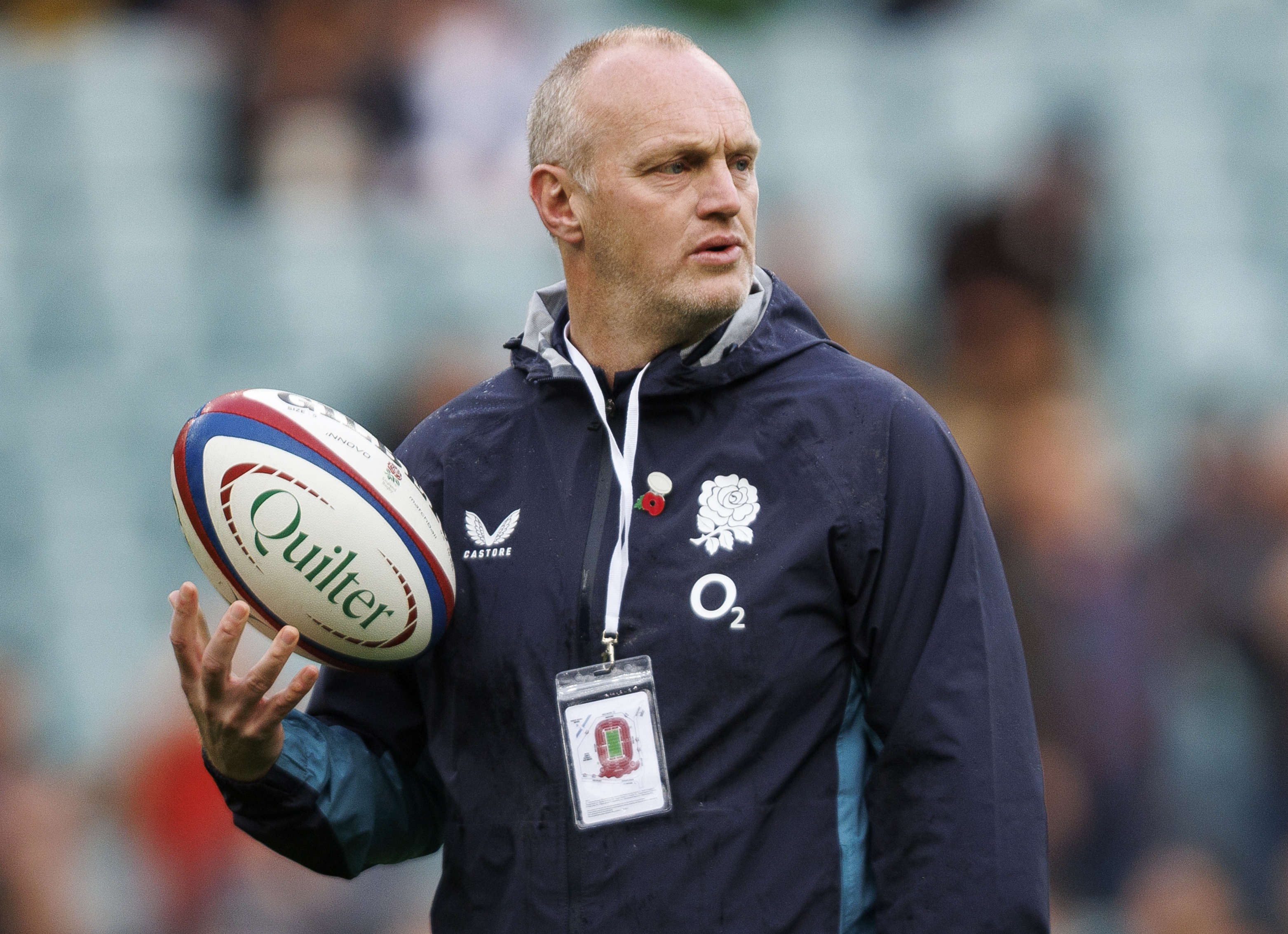 England's Attack Coach Lee Blackett holding a rugby ball during the Quilter Nations Series 2025 match.