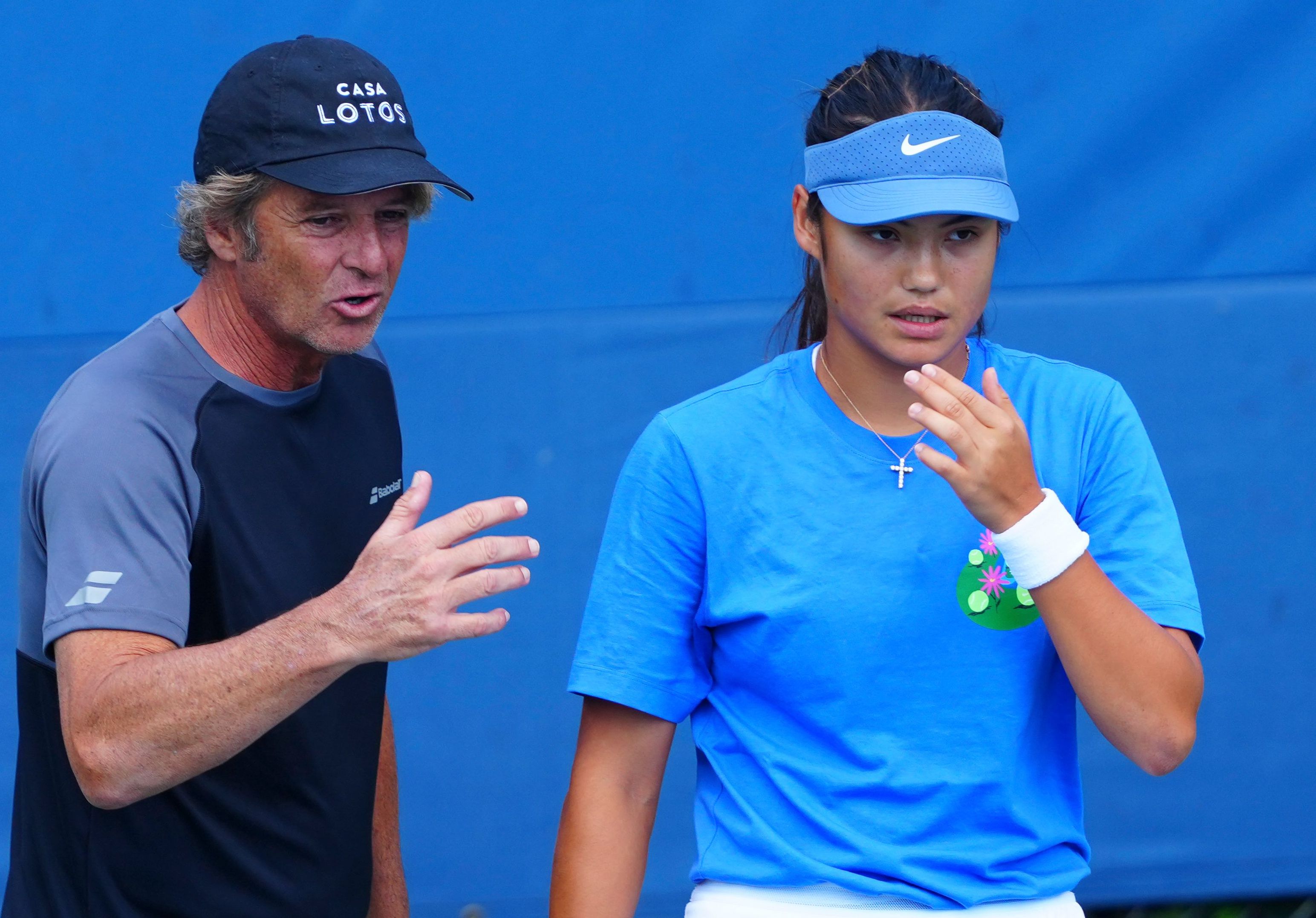 Emma Raducanu practices with coach Francisco Roig.