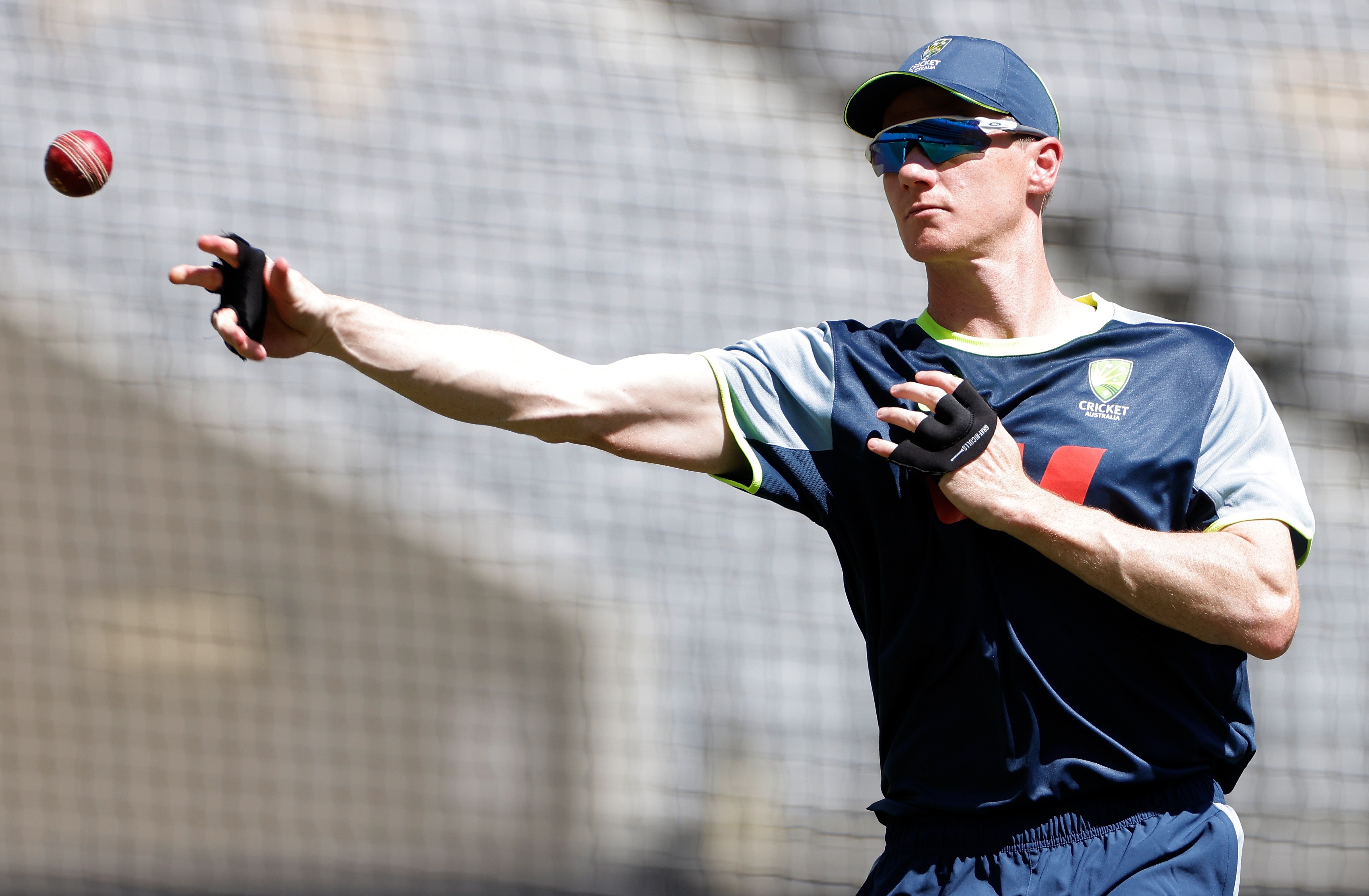 Brendan Doggett of Australia throwing a cricket ball during a training session.