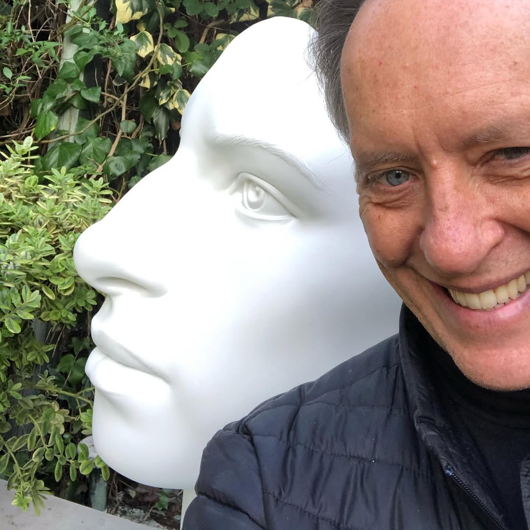 Richard E. Grant next to his Barbra Streisand statue.