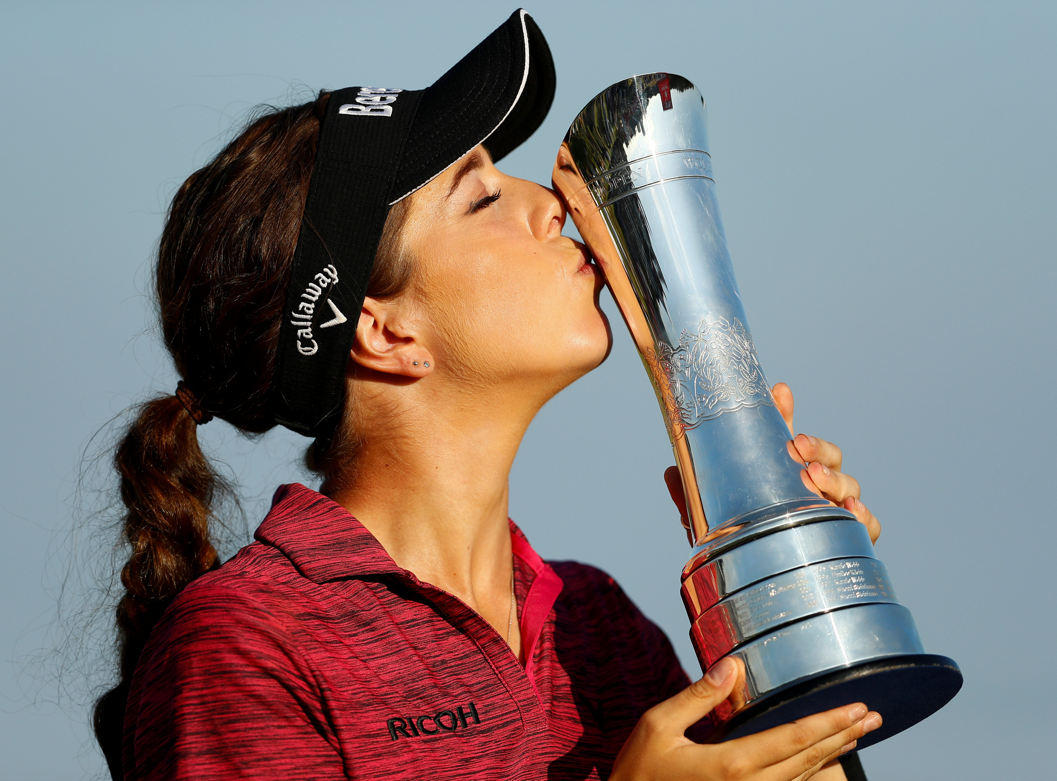 Georgia Hall kisses the Women's British Open trophy.