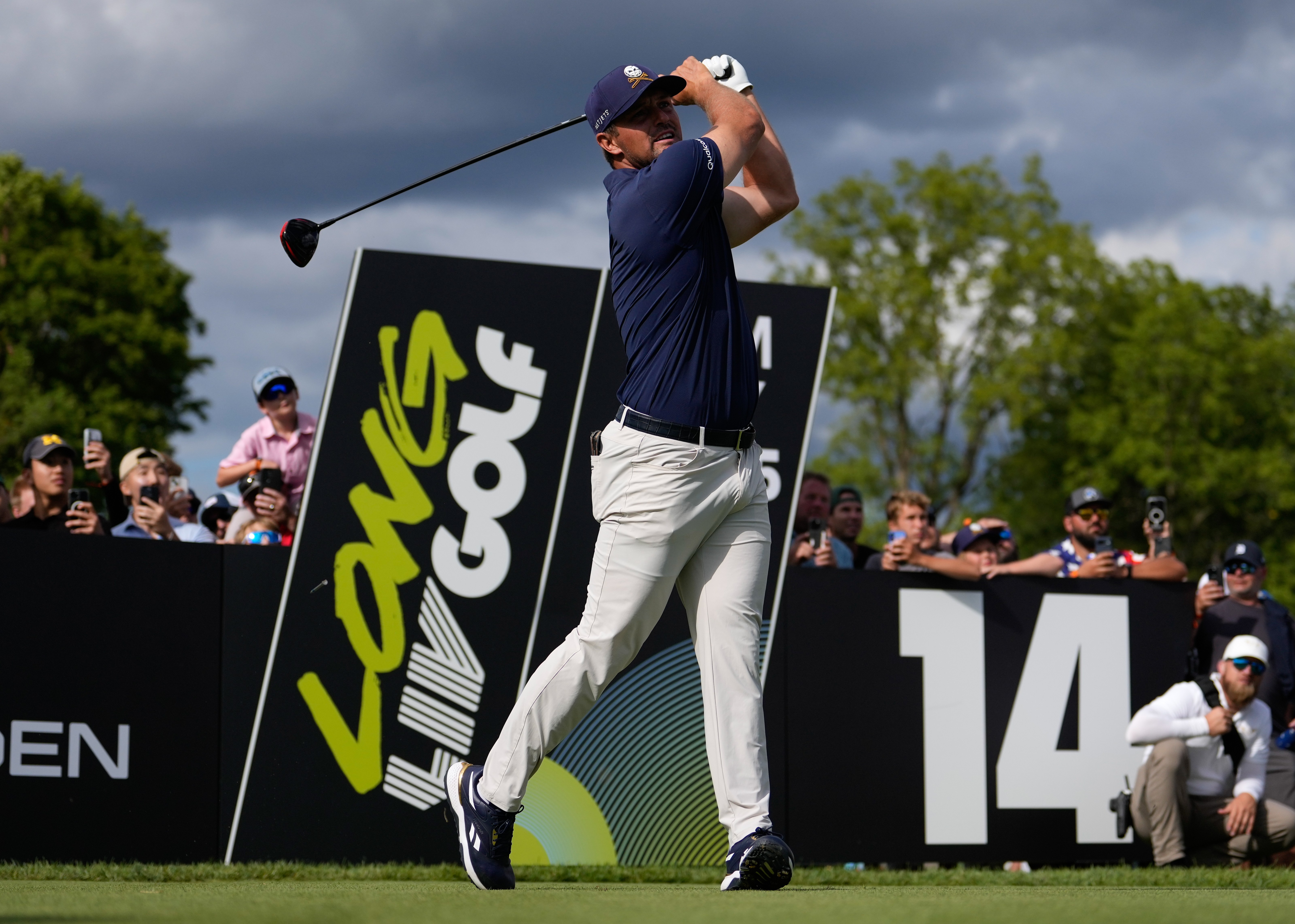 Bryson DeChambeau of Crushers GC plays his shot from the 14th tee at the LIV Golf Team Championship Michigan.
